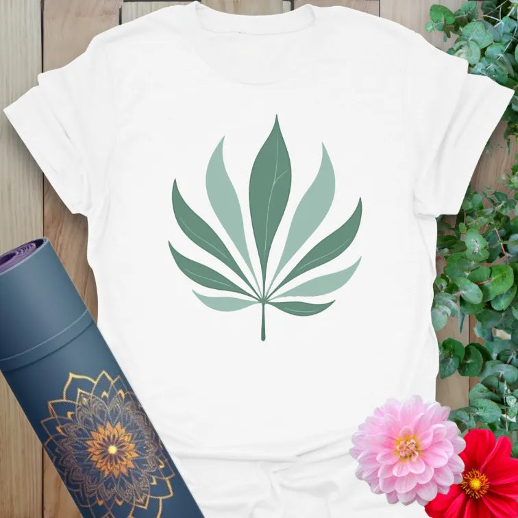 Clean white unisex yoga t-shirt featuring minimalist palm leaf artwork for conscious, nature-connected mindful living.