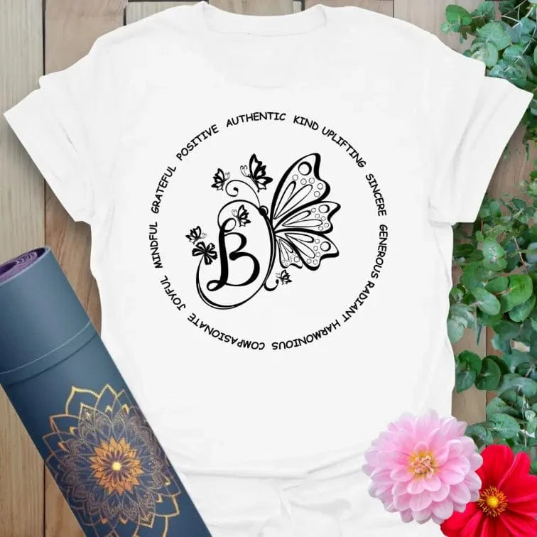 Clean white unisex yoga t-shirt with affirmational butterfly artwork inspiring kindness, authenticity, and joyful mindful movement.