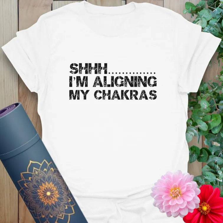 Clean white unisex yoga t-shirt featuring fun mindful living quote inspiring peace, quiet strength, and soulful mindfulness.