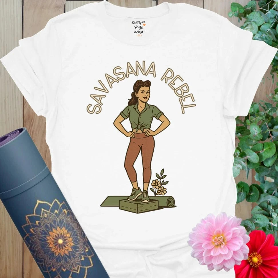 Crisp white cotton yoga tee with a bold retro yogi design standing proudly on a mat with floral detail.