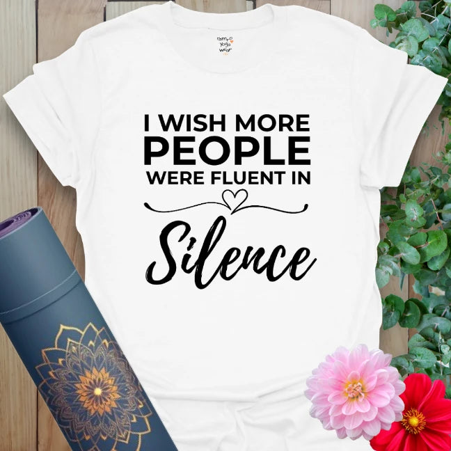 Clean white unisex yoga t-shirt featuring empowering "Fluent in Silence" design perfect for mindfulness lovers and soulful everyday wear.