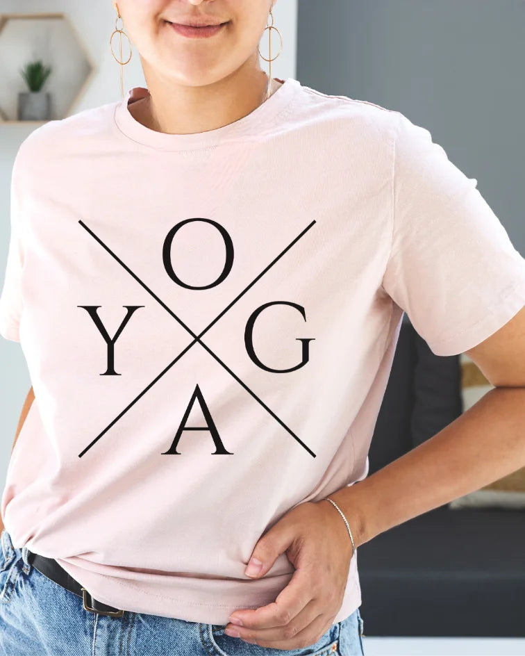 Pink Yoga Made Me T-Shirt with simple cross design. Soft mindful yoga graphic tee.