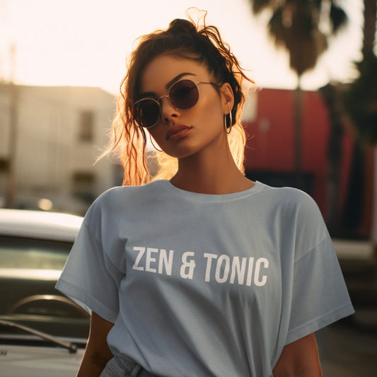 Woman wearing Zen Tonic T-Shirt Stone Blue sacred yoga shirt outdoors with sunglasses — The Vault collection by Ramro Yoga Wear