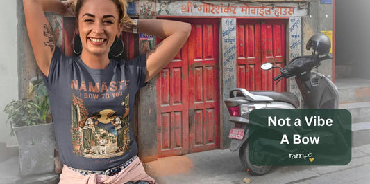 Woman wearing the Bow T-Shirt by Ramro Yoga Wear in front of a red-doored building with Nepali signage and a parked scooter — "Not a Vibe. A Bow." banner for the Namaste meaning article