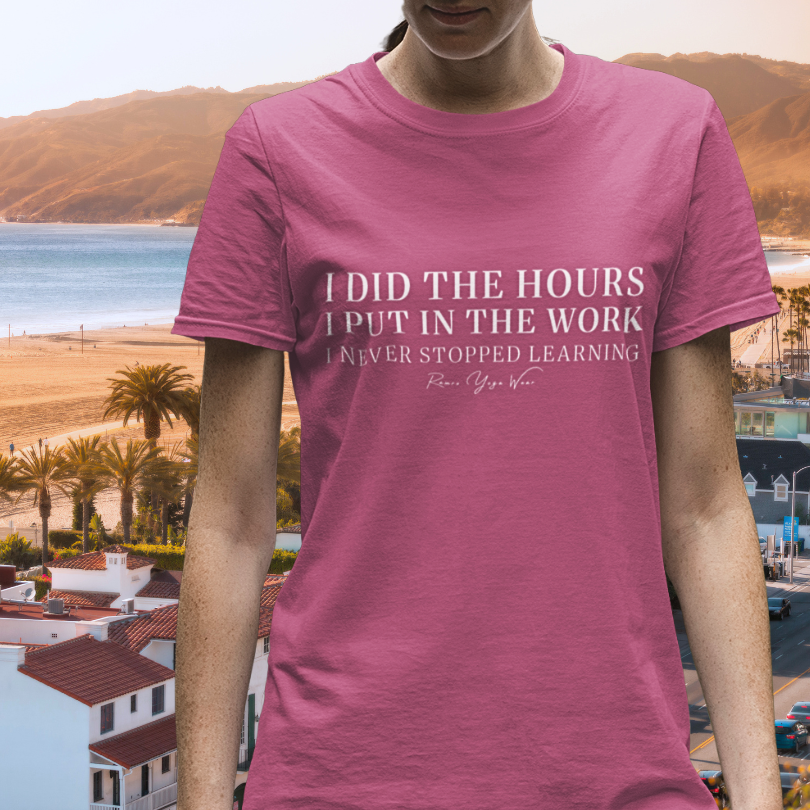 Woman wearing 200 Heather Raspberry yoga teacher gift tee at a California coastal setting — Yoga Teacher Gifts collection by Ramro Yoga Wear