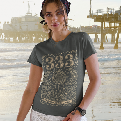 Woman wearing 333 dark heather grey angel number meditation shirt at beach — Dark Sacred Stillness collection by Ramro Yoga Wear