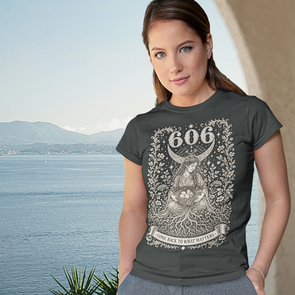 Woman wearing 606 T-Shirt dark heather grey sacred yoga shirt by the water — Dark Sacred Stillness collection by Ramro Yoga Wear