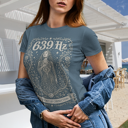 Person wearing 639 Hz Indigo Blue sacred yoga shirt at a beachside café — Dark Sacred Stillness collection by Ramro Yoga Wear