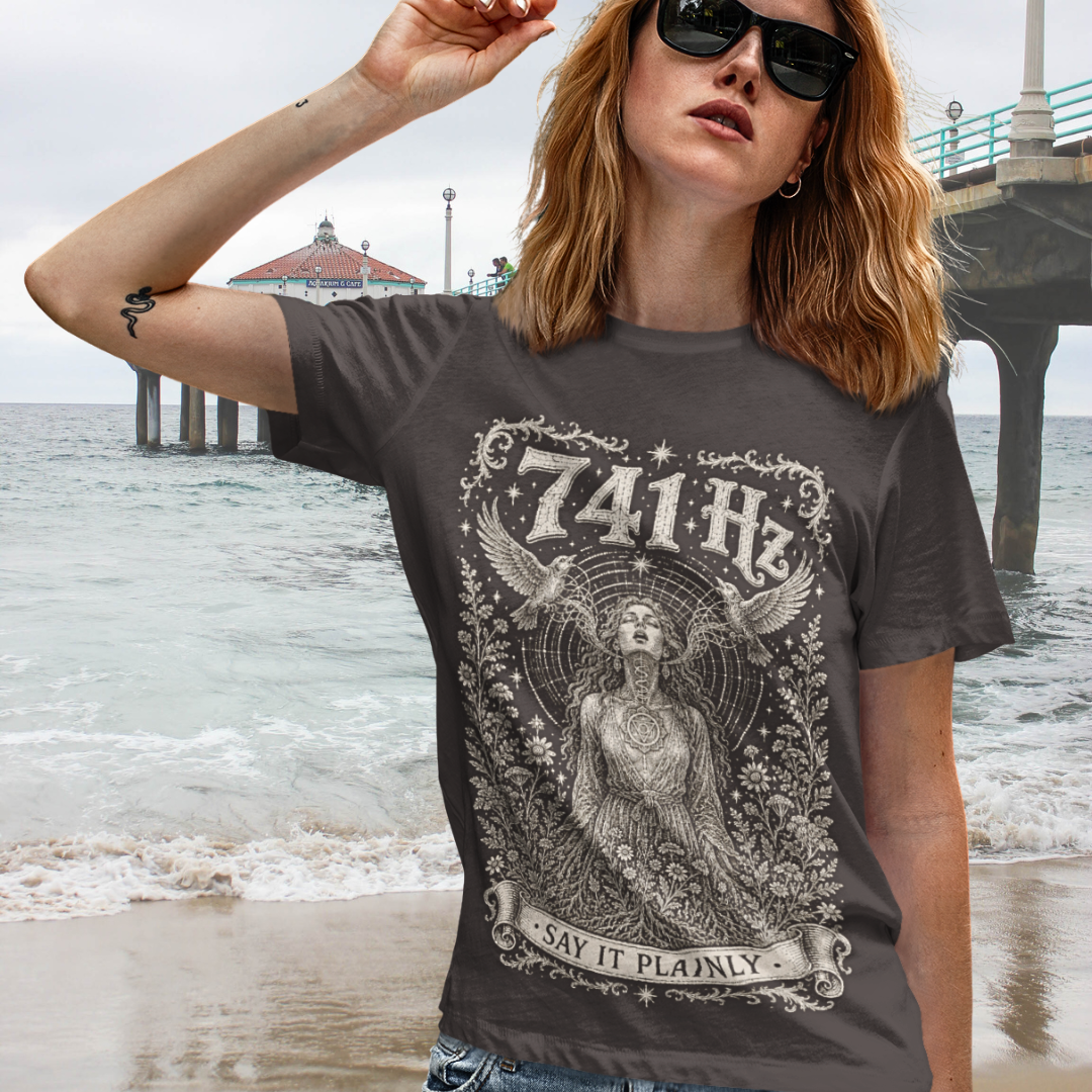 Person wearing 741 Hz Dark Chocolate sacred yoga shirt at the beach — Dark Sacred Stillness collection by Ramro Yoga Wear