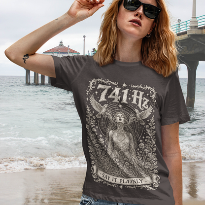 Person wearing 741 Hz Dark Chocolate sacred yoga shirt at the beach — Dark Sacred Stillness collection by Ramro Yoga Wear