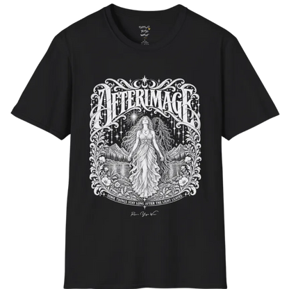 A short sleeved tee called the Afterimage T-Shirt, flat lay and a Gildan 64000 shirt on a white background. Simply says, Some Things Stay Long After The Light Leaves. Design highlights a long-haired figure in a flowing gown standing before a faint ghosted double of herself, under a starry sky with mountains, a lake and an ornate floral frame. Color is Black.