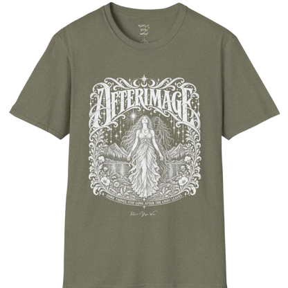 A short sleeved tee called the Afterimage T-Shirt, flat lay and a Gildan 64000 shirt on a white background. Simply says, Some Things Stay Long After The Light Leaves. Design highlights a long-haired figure in a flowing gown standing before a faint ghosted double of herself, under a starry sky with mountains, a lake and an ornate floral frame. Color is Heather Military Green.