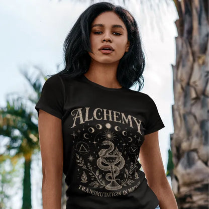 Woman wearing the black Alchemy T-Shirt outdoors with mystical celestial artwork and vintage spiritual streetwear styling.
