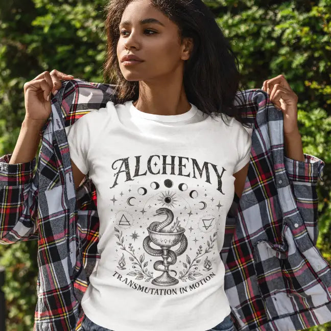 Lifestyle mockup of the Alchemy T-Shirt featuring vintage moon phase artwork and relaxed yoga-inspired fashion styling.