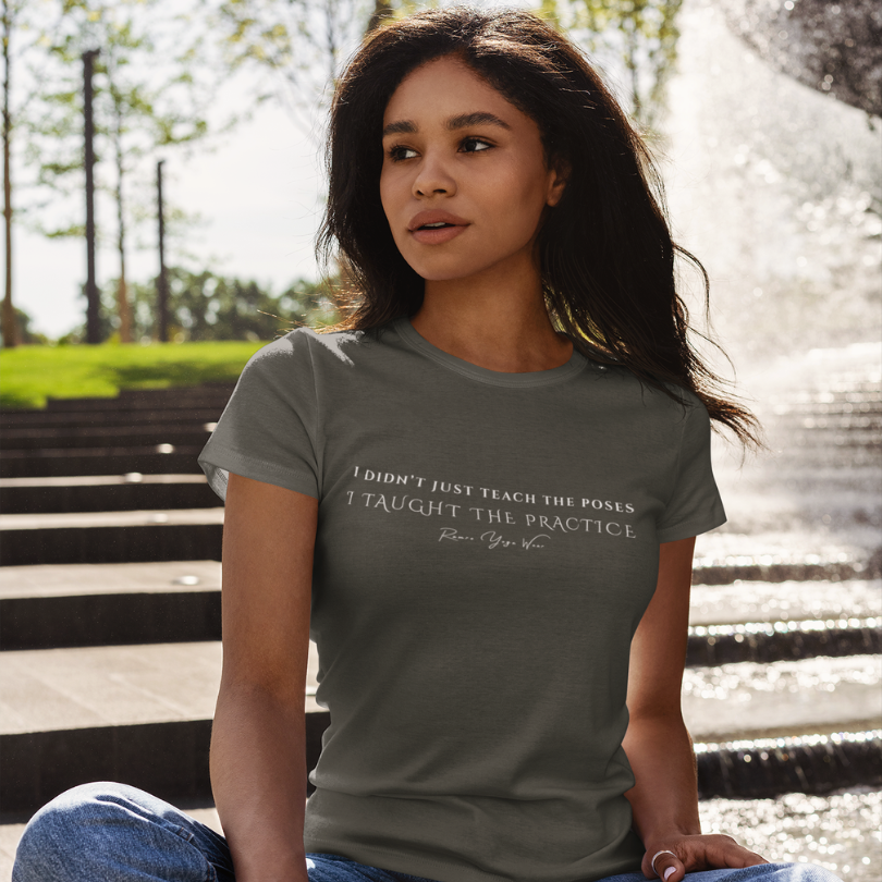 Woman wearing Ancient Military Green yoga teacher gift tee sitting by a fountain — Yoga Teacher Gifts collection by Ramro Yoga Wear