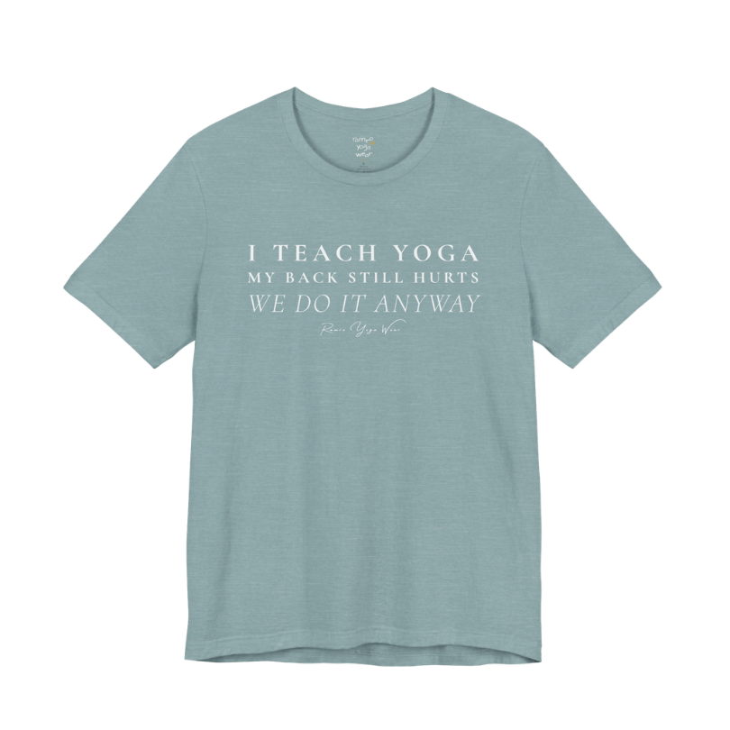 I TEACH YOGA MY BACK STILL HURTS WE DO IT ANYWAY yoga teacher gift tee flat lay in Heather Blue Lagoon — Yoga Teacher Gifts collection by Ramro Yoga Wear