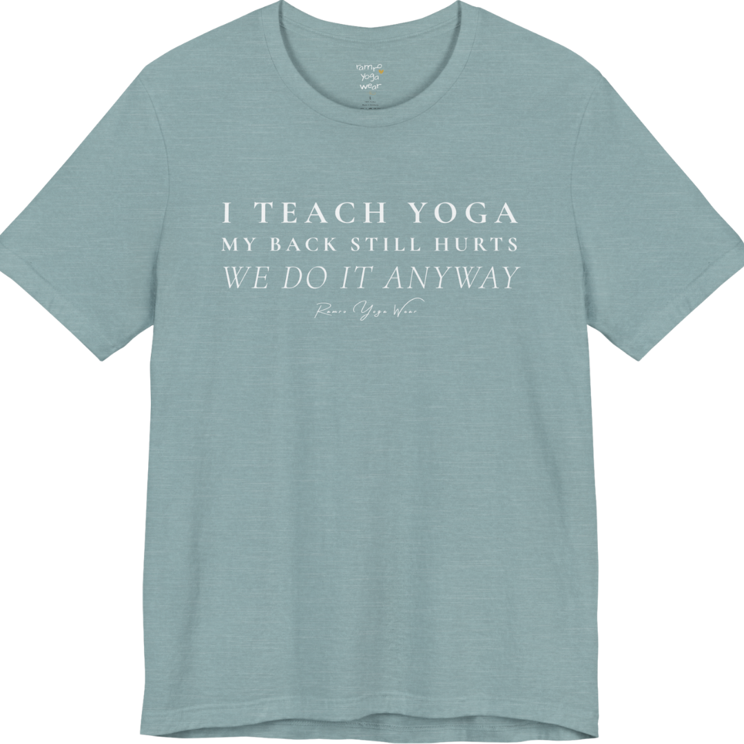 I TEACH YOGA MY BACK STILL HURTS WE DO IT ANYWAY yoga teacher gift tee flat lay in Heather Blue Lagoon — Yoga Teacher Gifts collection by Ramro Yoga Wear