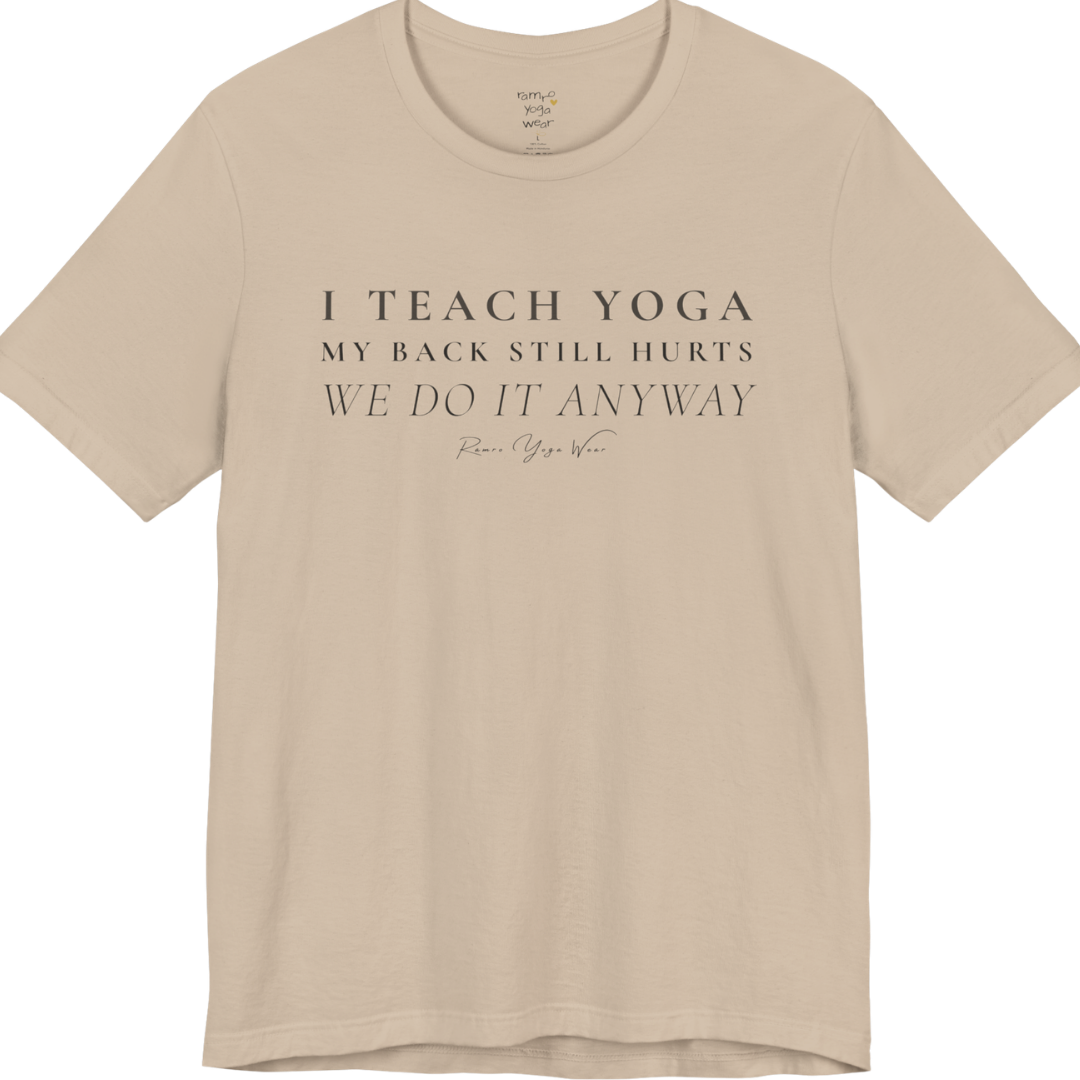 I TEACH YOGA MY BACK STILL HURTS WE DO IT ANYWAY yoga teacher gift tee flat lay in Tan — Yoga Teacher Gifts collection by Ramro Yoga Wear