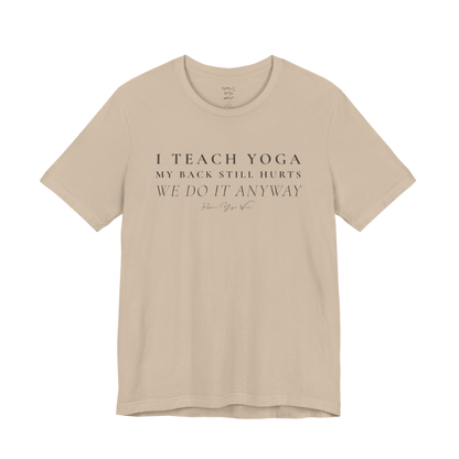I TEACH YOGA MY BACK STILL HURTS WE DO IT ANYWAY yoga teacher gift tee flat lay in Tan — Yoga Teacher Gifts collection by Ramro Yoga Wear