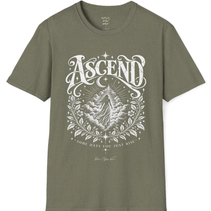 A short sleeved Tee with a figure rising through layered clouds toward a staircase of light, framed by a diamond-shaped botanical border with stars and a crescent moon above. Ascend T-Shirt flat lay is a Gildan 64000 and the color is Heather Military Green.