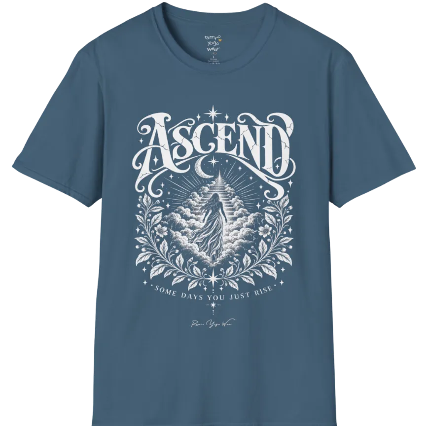 A short sleeved Tee with a figure rising through layered clouds toward a staircase of light, framed by a diamond-shaped botanical border with stars and a crescent moon above. Ascend T-Shirt flat lay is a Gildan 64000 and the color is Indigo Blue.