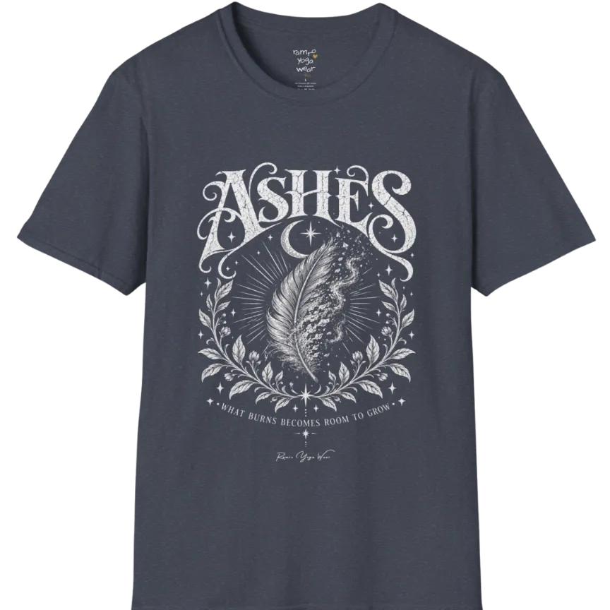 A single feather transforming into ash and ember against a dark starlit background, botanical framing below. Ashes T-Shirt flat lay is a Gildan 64000 and the color is Heather Navy.