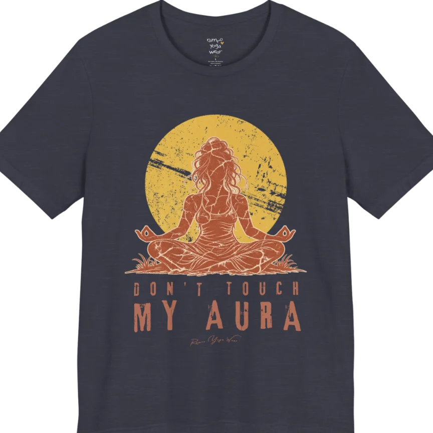 A short sleeved teed called the Aura T-Shirt, flat lay and a Bella + Canvas 3001 shirt. Simply says, Don't Touch My Aura. Design highlights a person meditating with a large bright sun in the background, all in a rustic, distressed illustration. Color is Heather Midnight Navy.