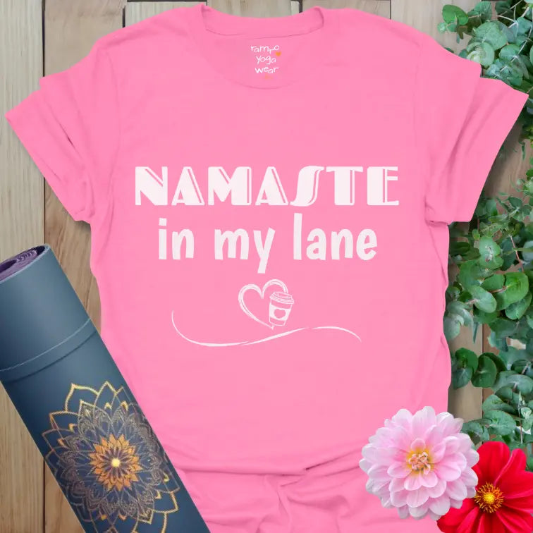 Azalea Lane T-Shirt with “Namaste in my lane” message and coffee-heart graphic, soft pink yoga tee for mindful mornings and everyday calm.