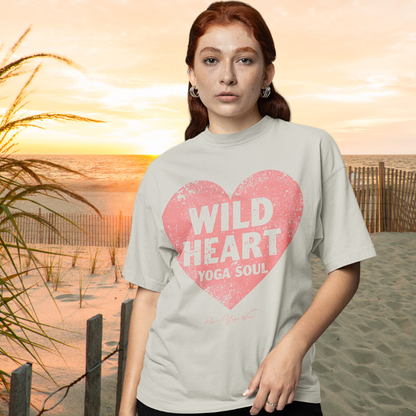 Woman wearing Bad Girls Heather Prism Natural funny yoga shirt at beach golden hour — Funny Yoga Shirts collection by Ramro Yoga Wear