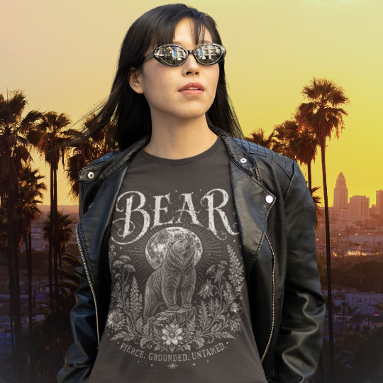 Ramro Yoga Wear Bear tee in Dark Chocolate — fierce grounded untamed bear design, LA city palm trees sunset lifestyle shot