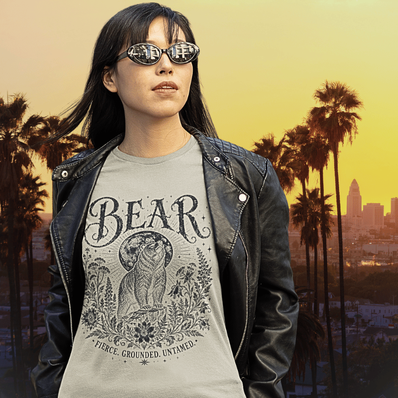 Ramro Yoga Wear Bear tee in Sand — fierce grounded untamed bear design, LA city palm trees sunset lifestyle shot