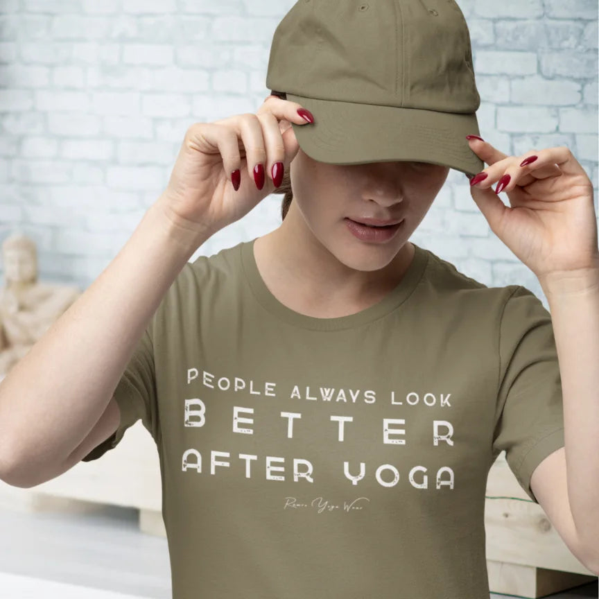 Person wearing Better Heather Olive tee, adjusting a her cap in yoga class  — Funny Yoga Shirts collection by Ramro Yoga Wear