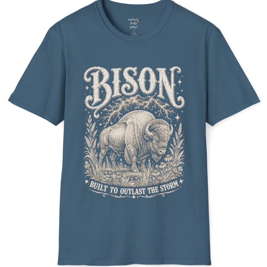 A short sleeved grunge tee with an illustrated bison design, botanical linework framing the scene, text reading "Bison" and "Built To Outlast The Storm" — Wild Animals collection by Ramro Yoga Wear in Indigo Blue.