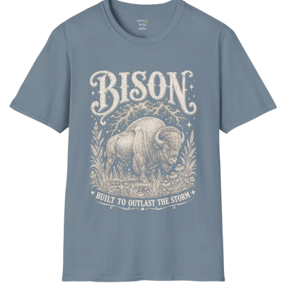 A short sleeved grunge tee with an illustrated bison design, botanical linework framing the scene, text reading "Bison" and "Built To Outlast The Storm" — Wild Animals collection by Ramro Yoga Wear in Stone Blue.