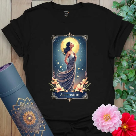 Black Ascension T-Shirt with digital illustration of a glowing woman beneath a full moon, surrounded by flowers and stars