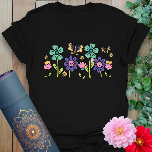 Black t-shirt with colorful hand-drawn wildflowers and butterfly graphic