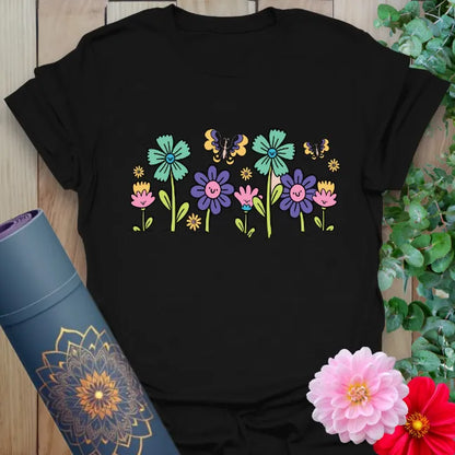 Black t-shirt with colorful hand-drawn wildflowers and butterfly graphic