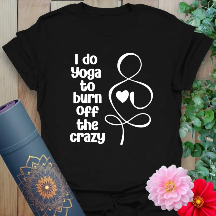 Black yoga t-shirt with “I do yoga to burn off the crazy” quote and heart graphic