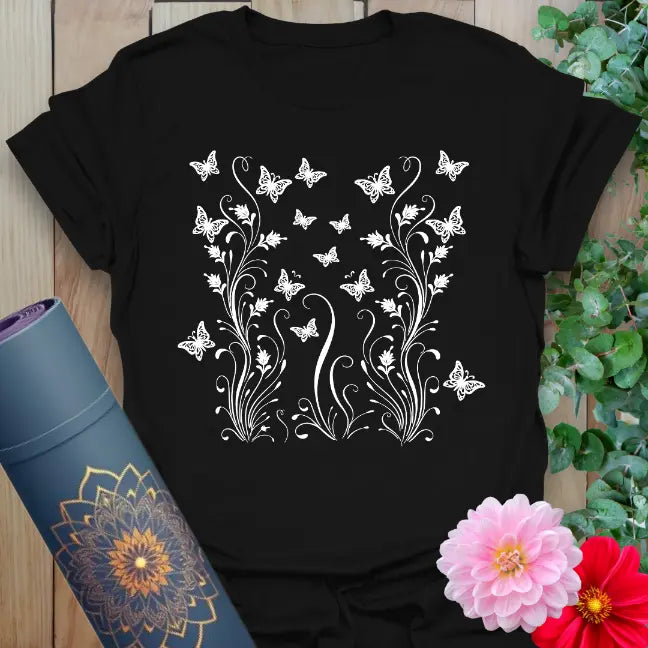 Black yoga t-shirt with white symmetrical butterfly and vine design