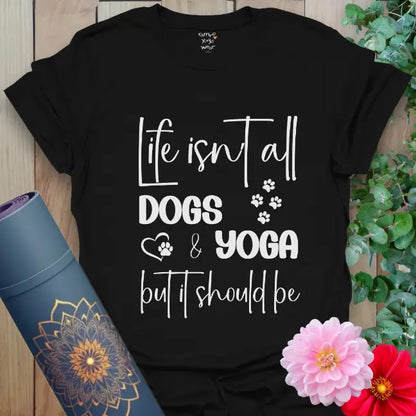 Black yoga t-shirt with playful "Life isn't all dogs and yoga" quote and paw prints