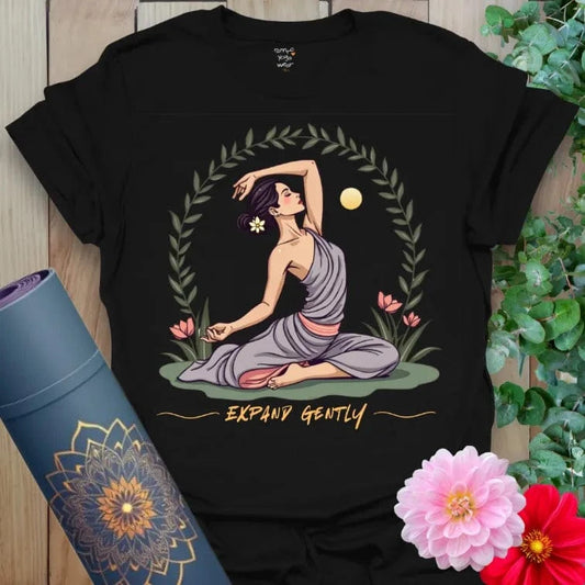 Classic black cotton yoga t-shirt with elegant yogi, sun, and floral design symbolizing patience and mindful movement.