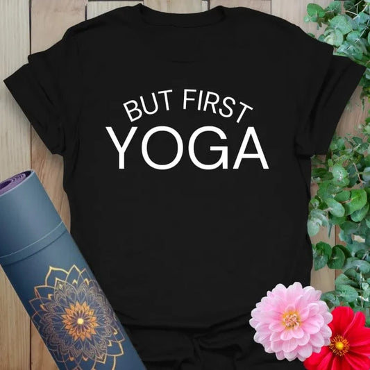 Classic black cotton yoga t-shirt with striking "But First, Yoga" lettering inspiring daily mindful practice.