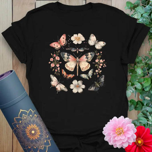Classic black cotton yoga t-shirt with whimsical butterfly and flower circle artwork for soulful, transformative journeys.
