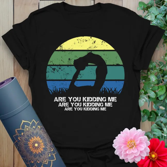 Classic black cotton yoga t-shirt featuring retro yogi sunset graphic and cheeky mindful living message.
