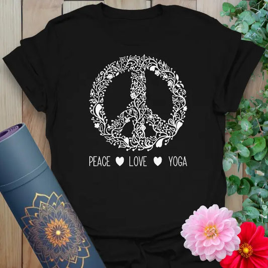 Classic black cotton yoga t-shirt showcasing artistic peace symbol and "Peace Love Yoga" affirmation for mindful, heart-centered living.