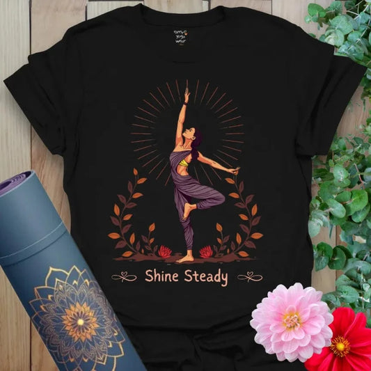 Classic black cotton yoga t-shirt showcasing radiant yogi and floral art design symbolizing empowerment, inner calm, and soulful strength.