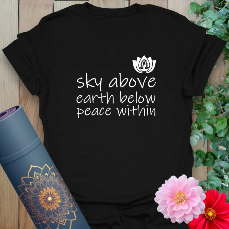 Classic black cotton yoga t-shirt showcasing inspiring "Sky Above, Earth Below, Peace Within" message for conscious, mindful everyday living.