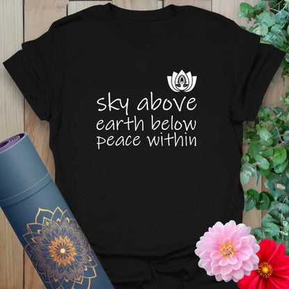 Classic black cotton yoga t-shirt showcasing inspiring "Sky Above, Earth Below, Peace Within" message for conscious, mindful everyday living.