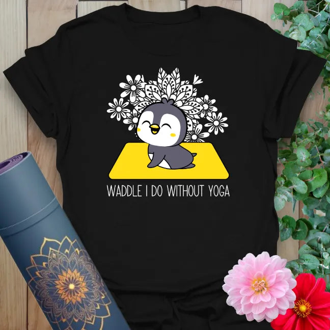 Classic black cotton t-shirt featuring joyful penguin yoga graphic and “Waddle I Do Without Yoga” design.