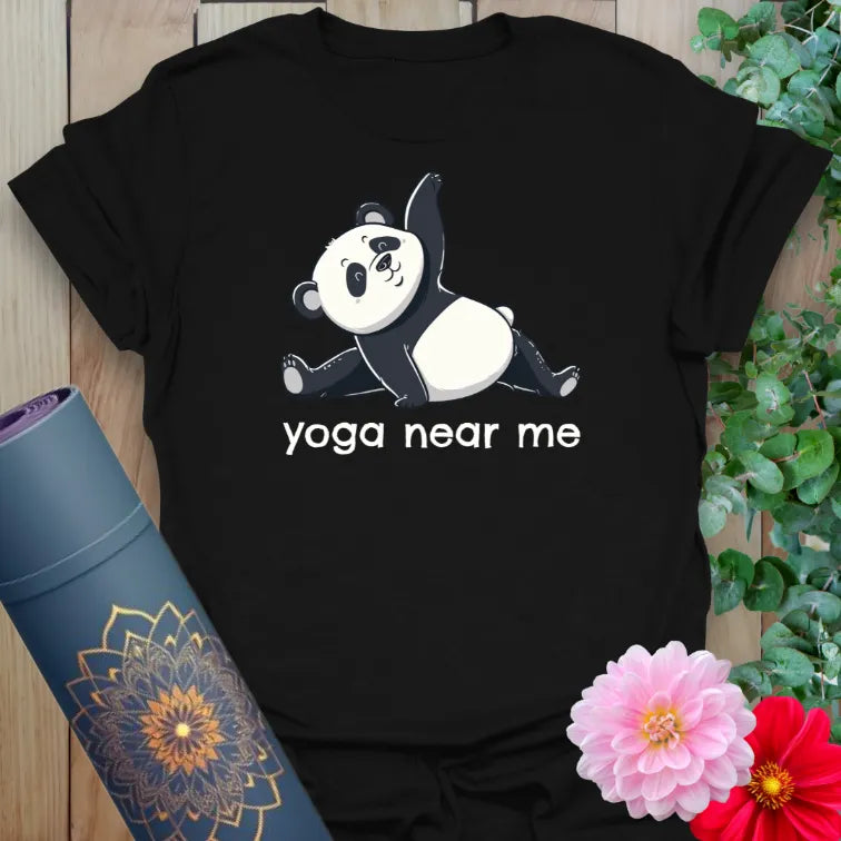Classic black cotton yoga t-shirt featuring a panda graphic and “yoga near me” phrase for playful yoga style.